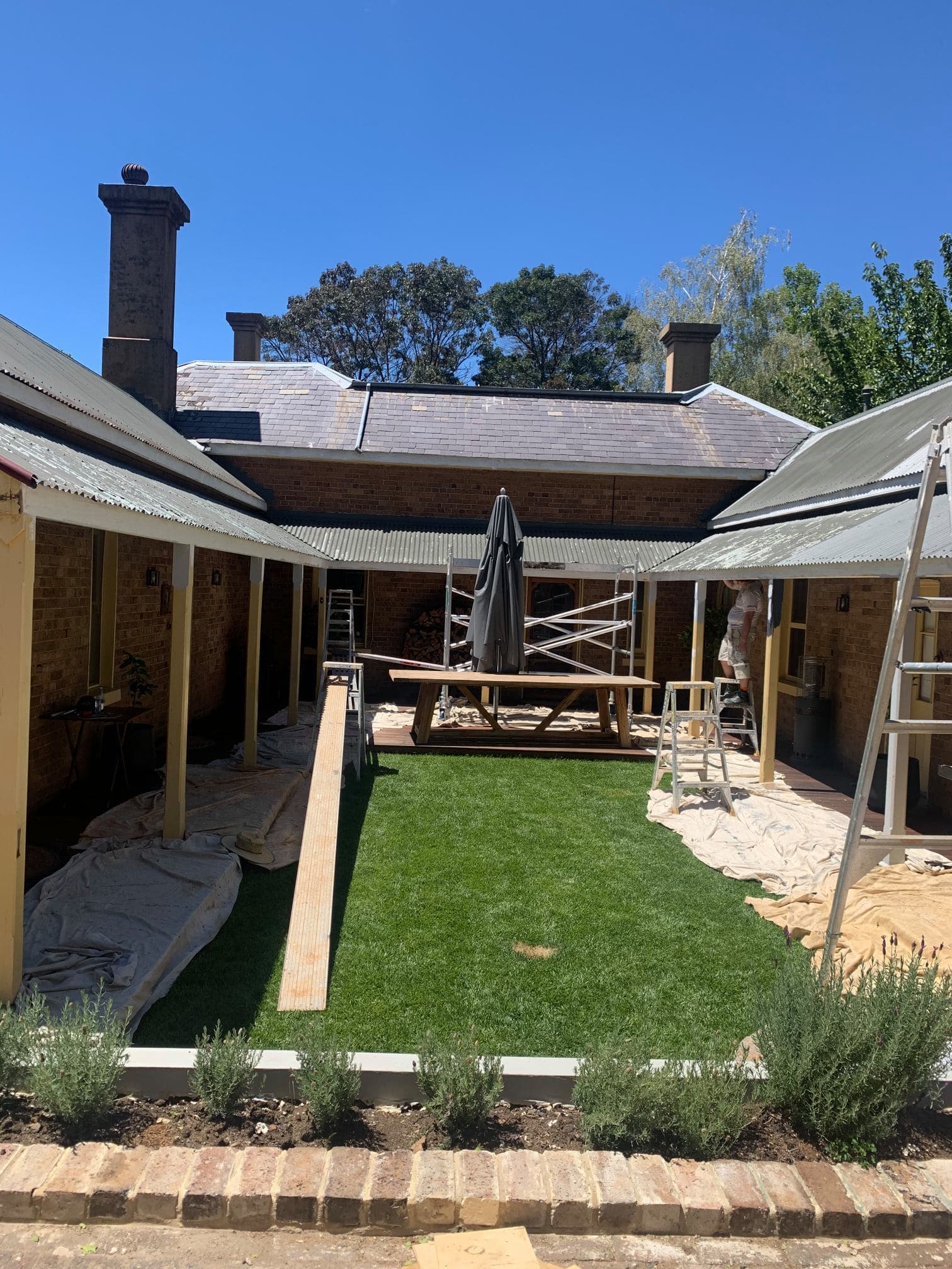Heritage brick property courtyard after repainting, Central West NSW