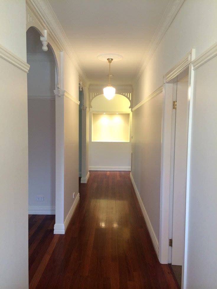 Heritage hallway with archway and fretwork, repainted by Murrays Painting in Orange NSW