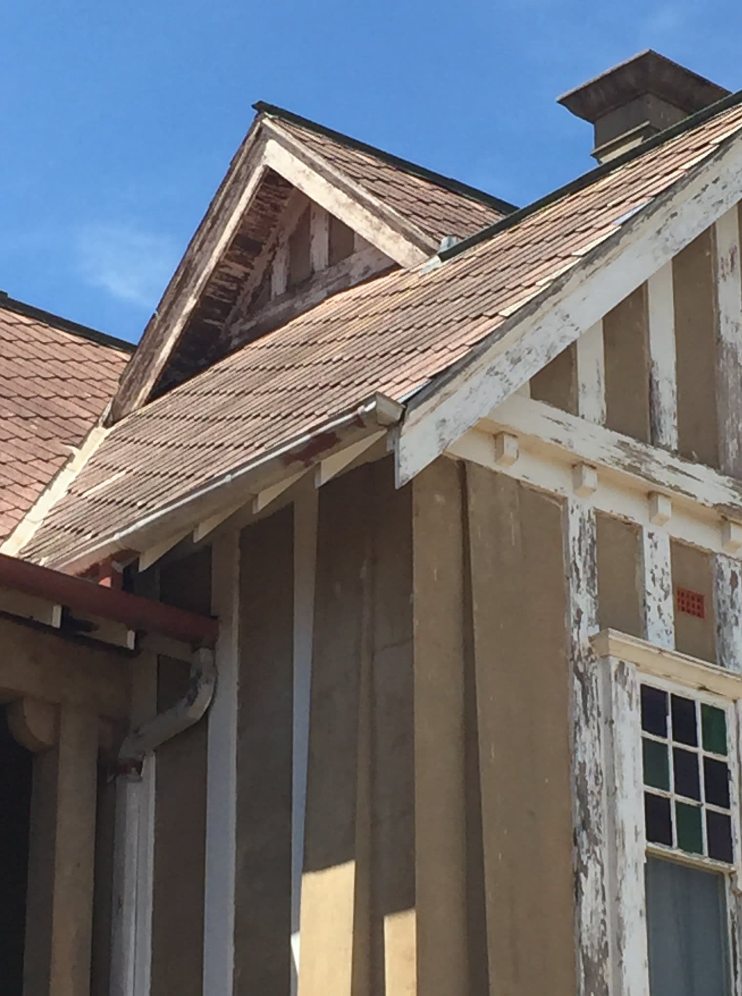 Heritage building with peeling paint before restoration, Central West NSW