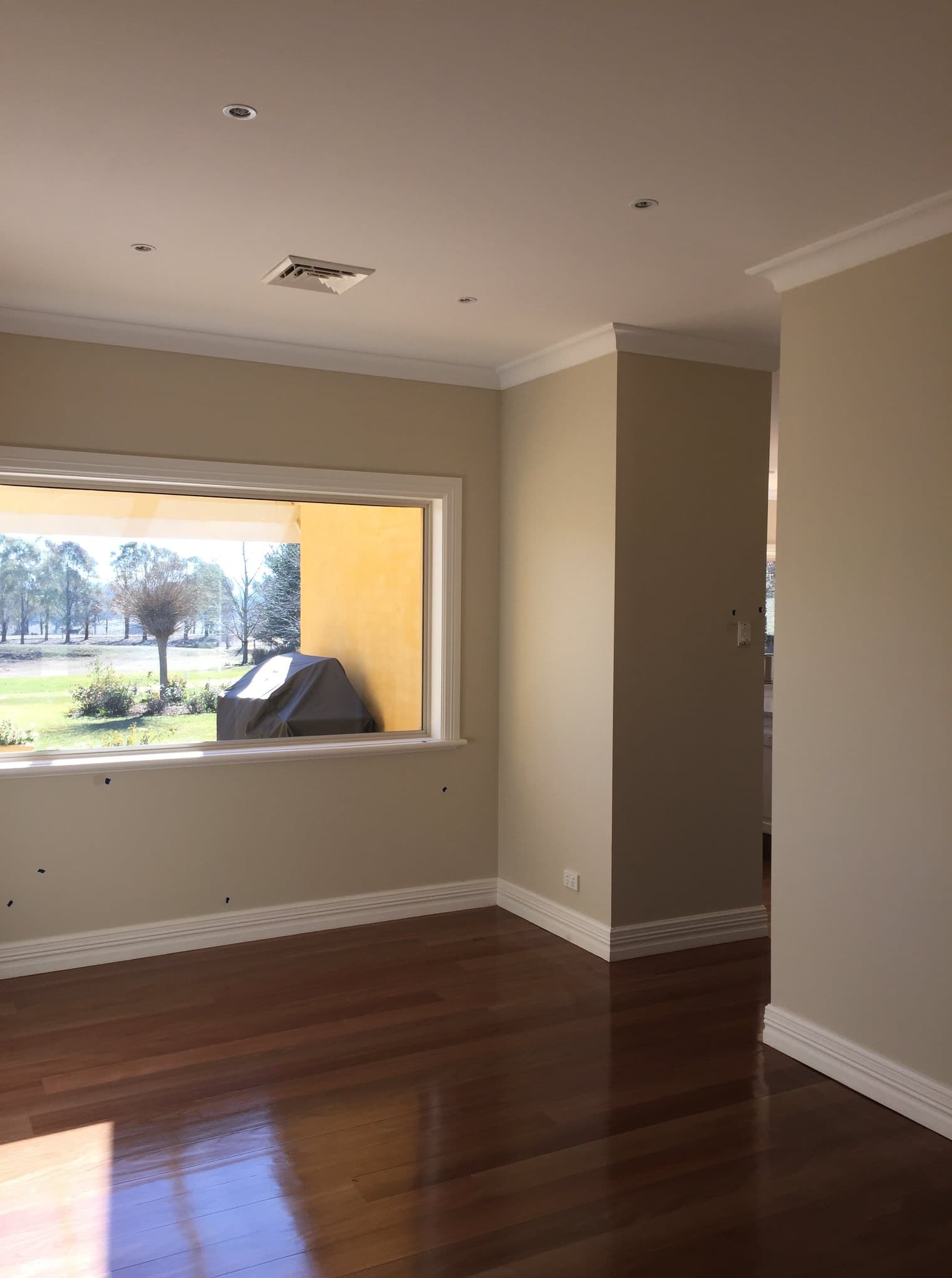 Living room repainted in warm beige with white trim, Central West NSW